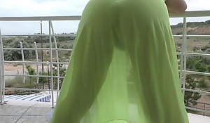 Hairy mature flashing on the top of balcony